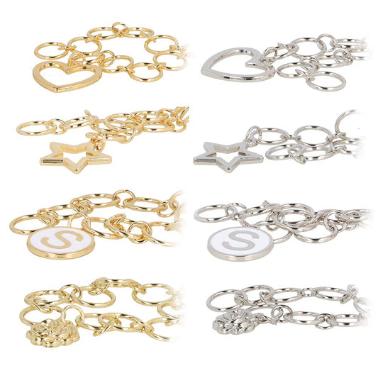 Gold and silver bracelets with various charms on a white background