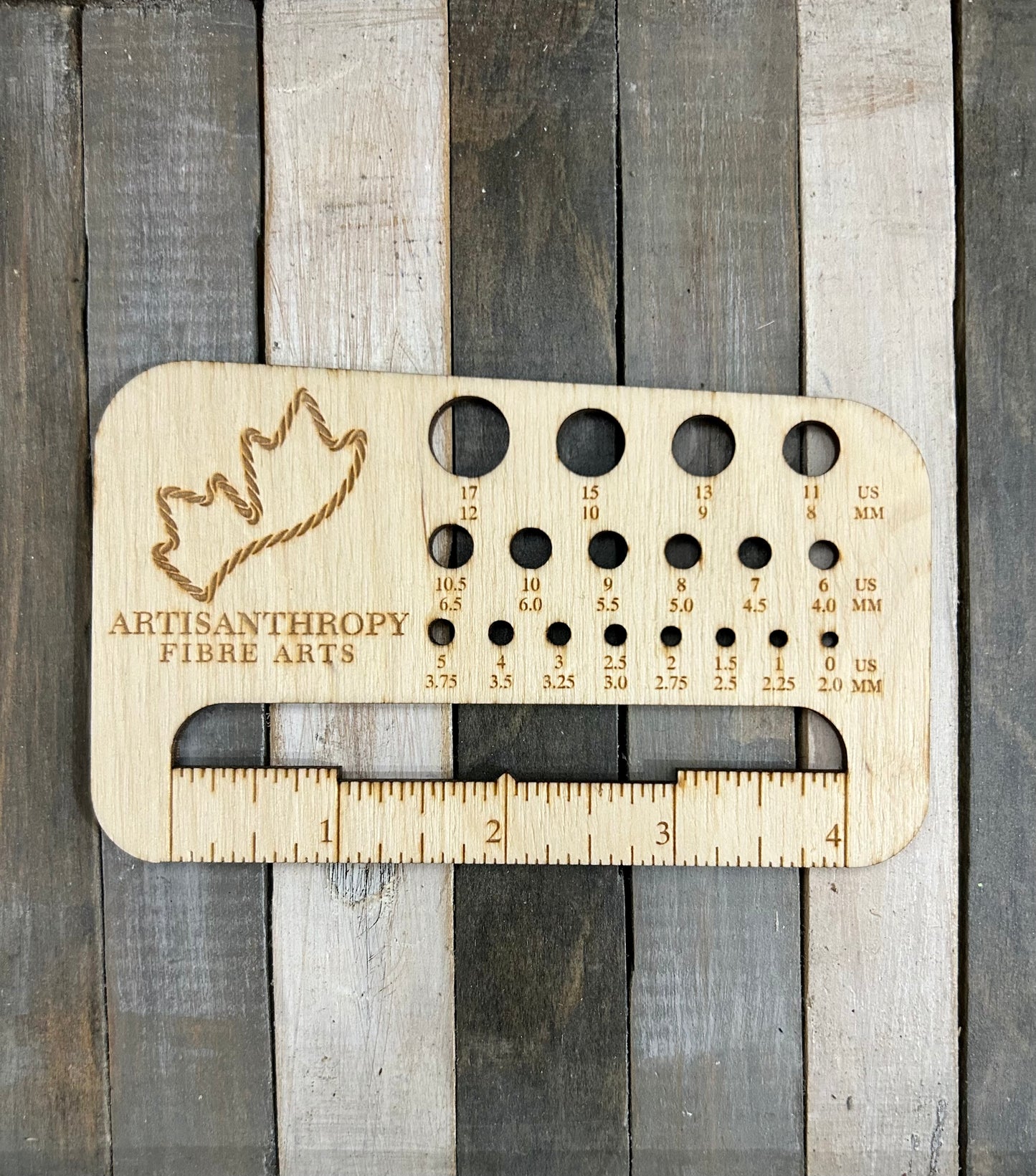 Artisanthropy branded lemonwood needle sizer and swatch gauge tool