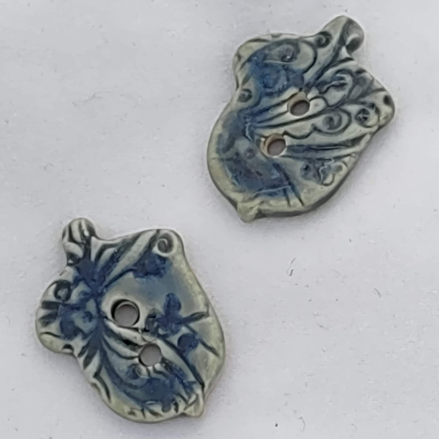 textured teal blue acorn buttons by flicker bug