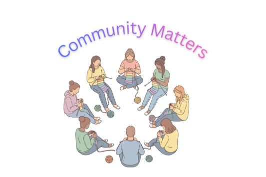 Group of people knitting together.