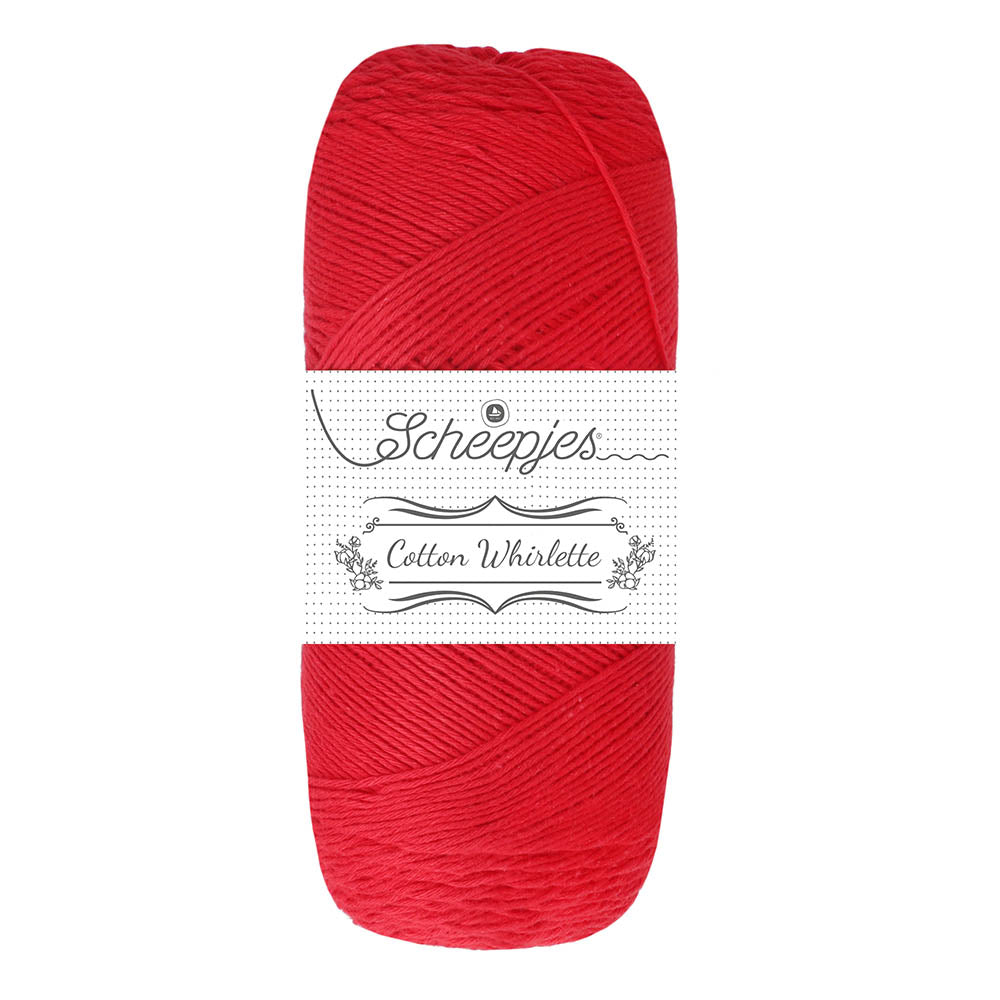 Red skein of yarn with a white label on a white background
