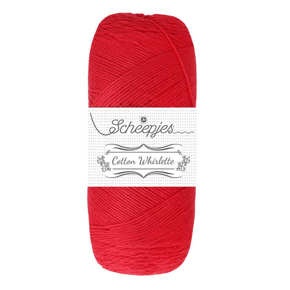 Red skein of yarn with a white label on a white background