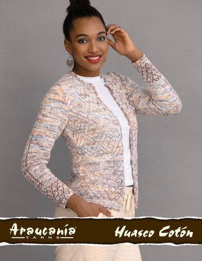 Woman wearing a textured cardigan with 'Araucania Huasco Coton' branding on a gray background
