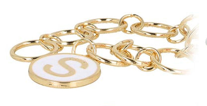 Gold and silver chains with various charms on a white background