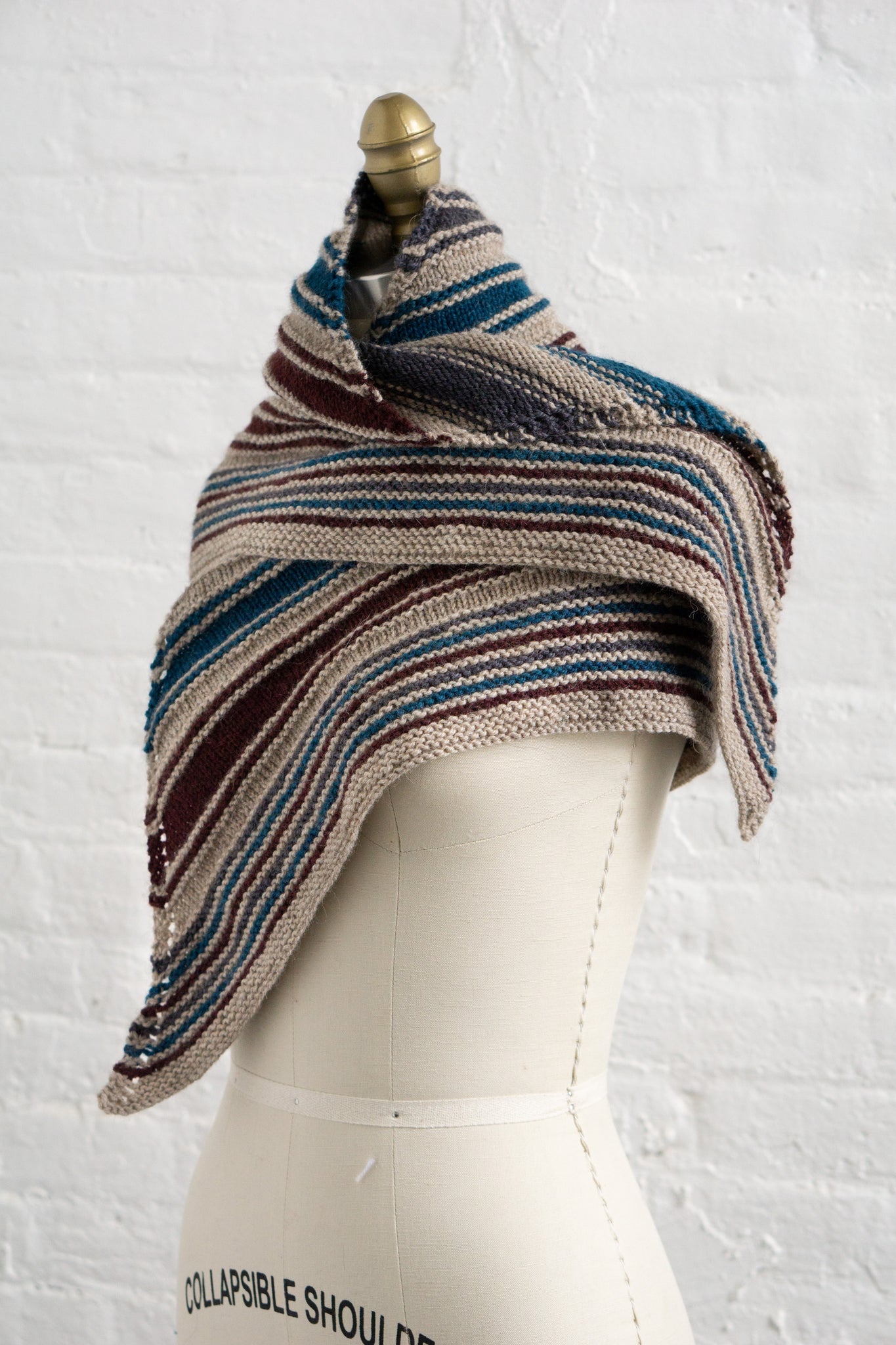 Racha Shawlette Pattern in H705 Toast (MC) + 1 sk each of H2540 Kohl, H2444 Harbor, and H2150 Bing Cherry