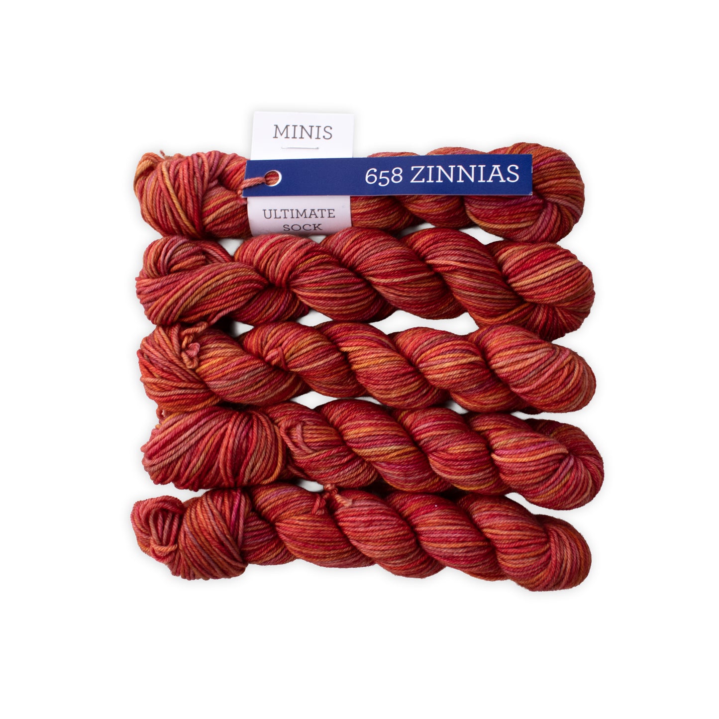Red yarn skeins with a label on a white background