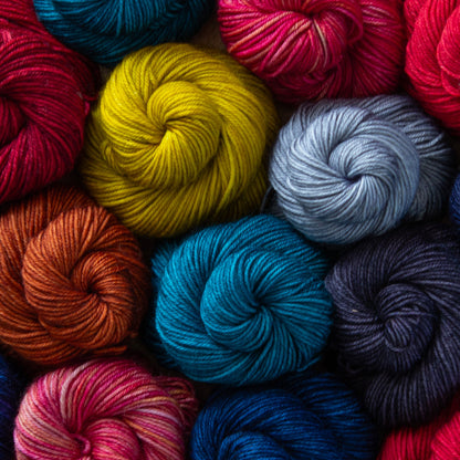 Assorted colorful yarn balls in a close-up shot