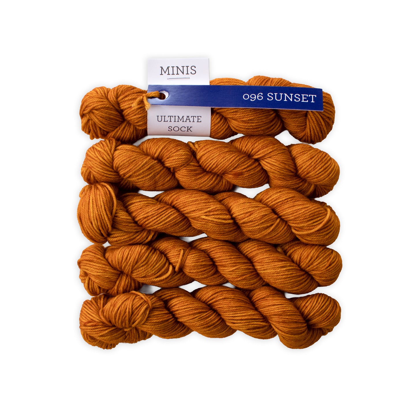 Orange yarn skeins with a label on a white background