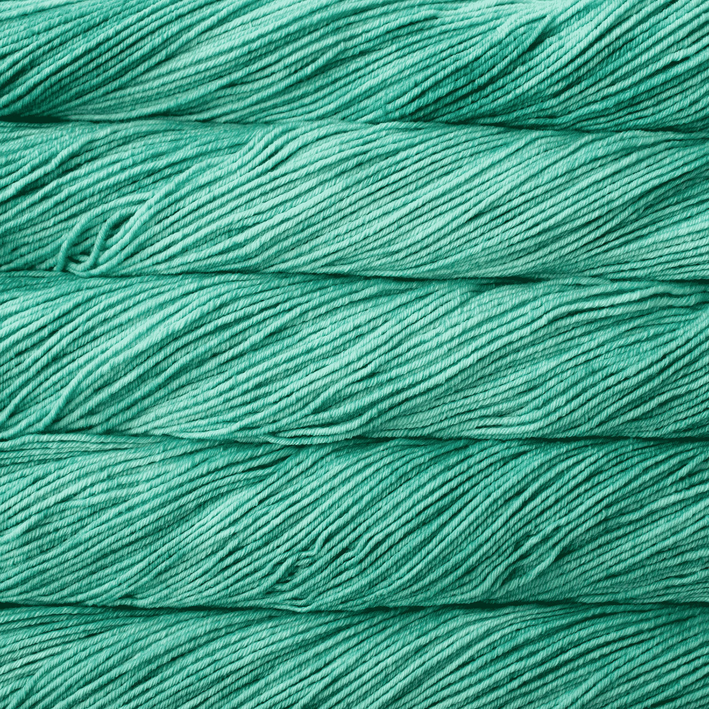 Close-up of teal yarn with a textured surface